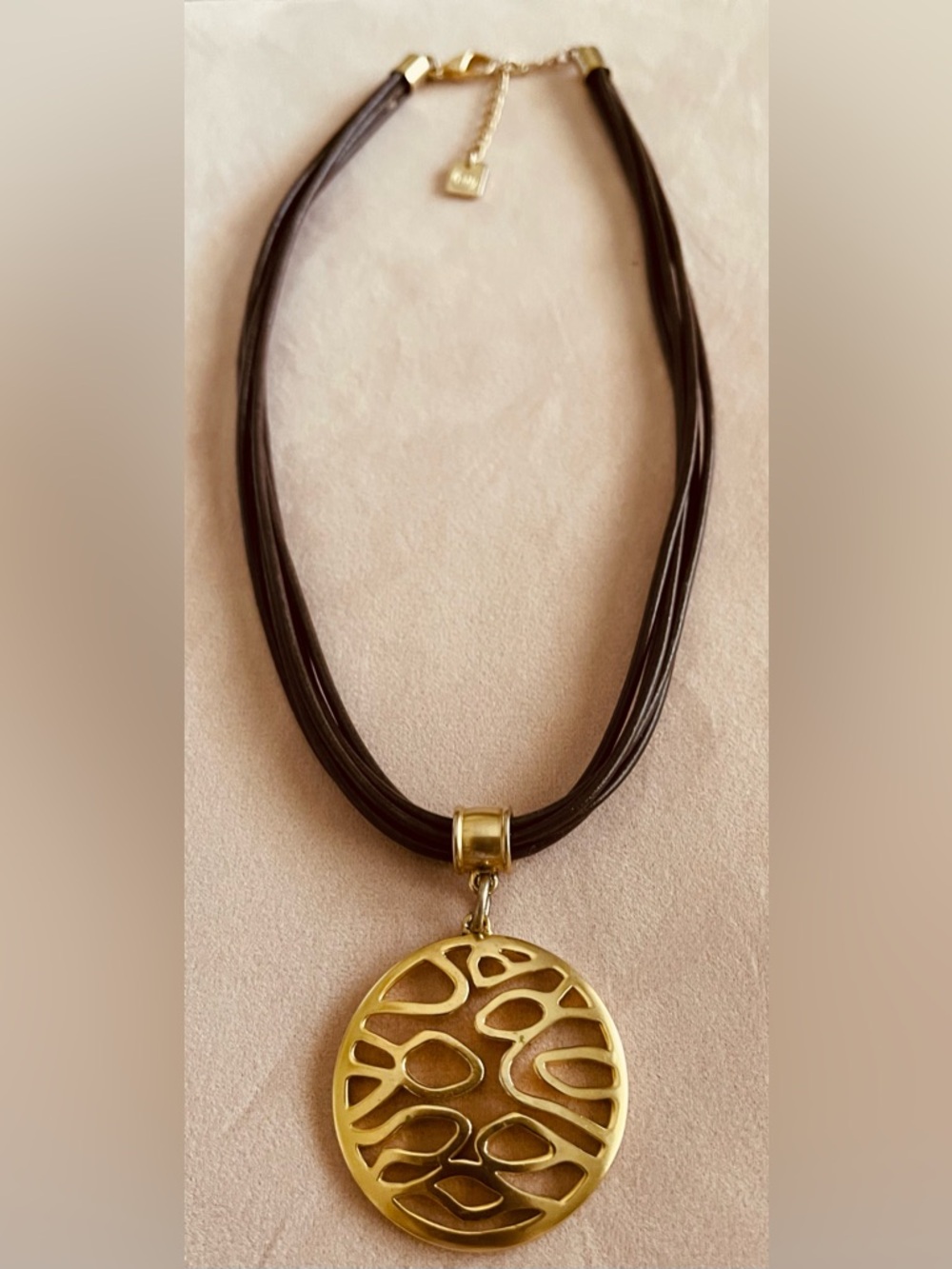 NINE WEST MULTI STRAND BROWN LEATHER NECKLACE WITH ROUND  GOLD ABSTRACT PENDANT
